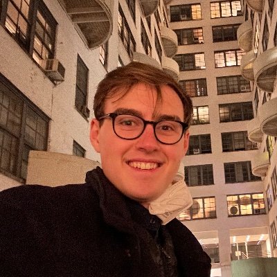 A circular photo of Miles; links to home.